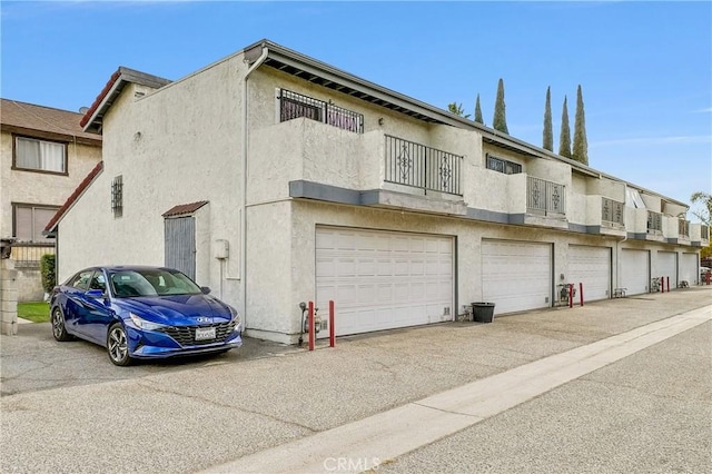 view of property exterior with a garage