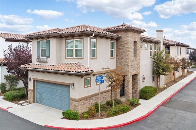 mediterranean / spanish-style home featuring a garage