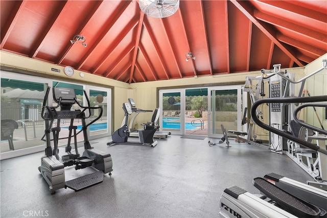 workout area featuring high vaulted ceiling