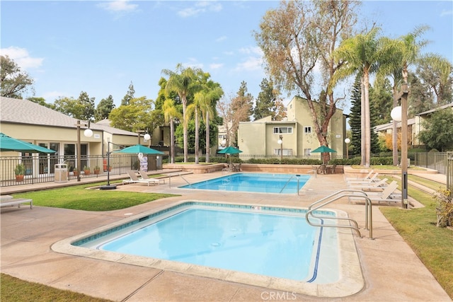 view of pool featuring a patio