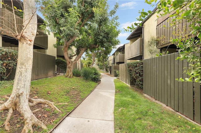 view of community featuring a yard