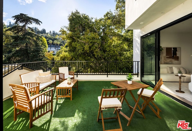 view of patio / terrace featuring outdoor lounge area and a balcony