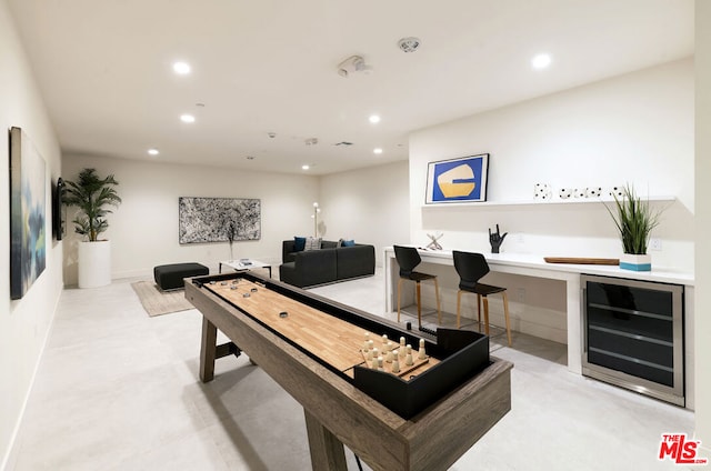 recreation room featuring beverage cooler and indoor bar