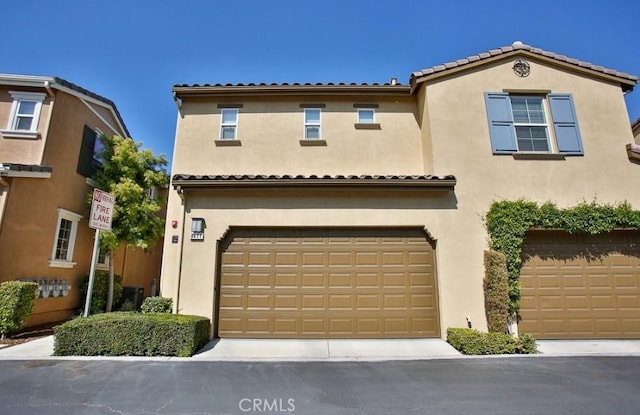 mediterranean / spanish-style home featuring a garage