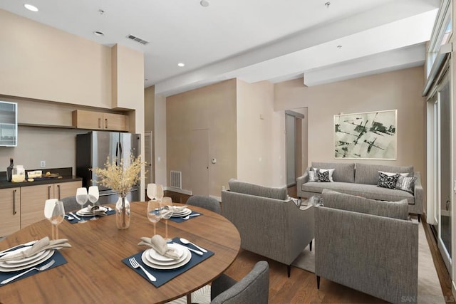 dining area featuring dark wood-type flooring