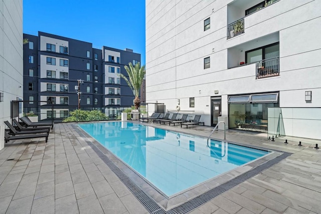 view of swimming pool with a patio