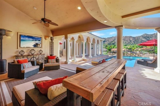 view of patio / terrace featuring outdoor lounge area, a mountain view, and ceiling fan