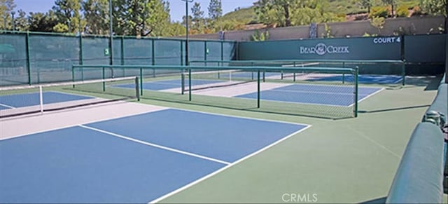 view of tennis court with basketball court