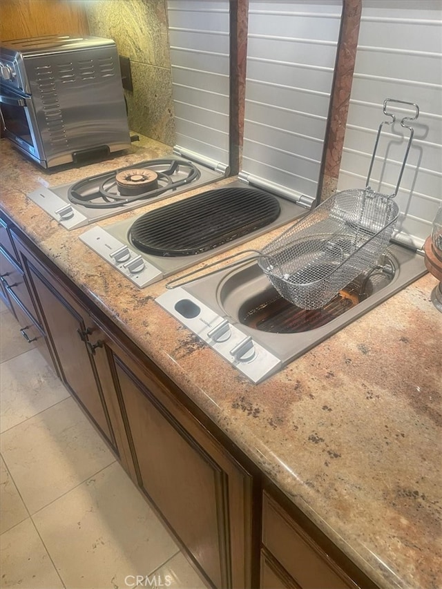 interior details featuring light stone countertops