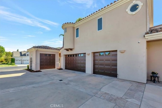 view of side of property with a garage