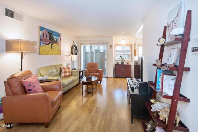 living room with light hardwood / wood-style flooring