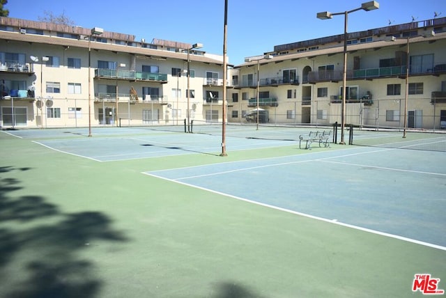 view of sport court featuring basketball hoop