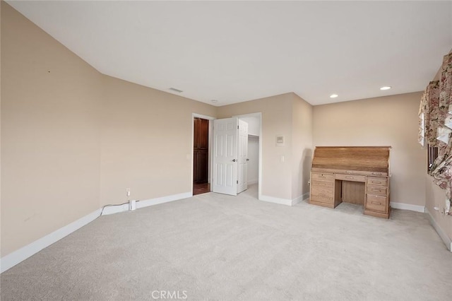 unfurnished living room featuring light colored carpet