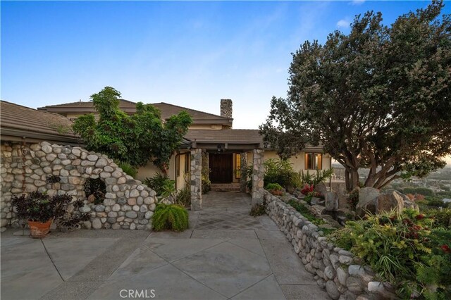 view of front of home with a patio area