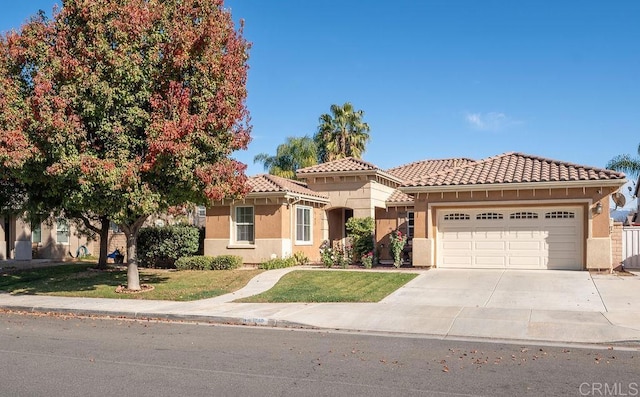 view of front of home featuring a garage and a front yard