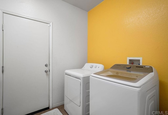 laundry area with independent washer and dryer