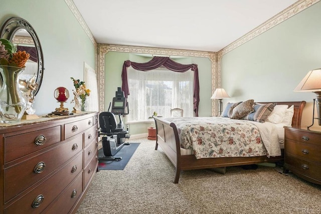 carpeted bedroom with ornamental molding