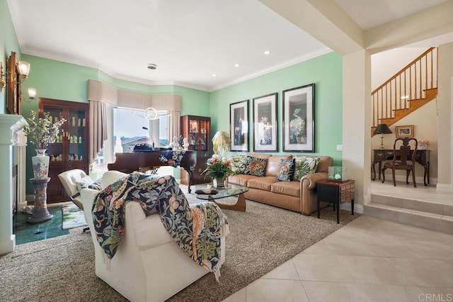 living room with crown molding, light tile patterned floors, and a notable chandelier