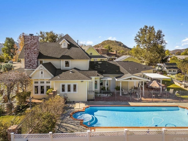 view of swimming pool featuring a mountain view