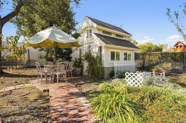 back of property with a patio area