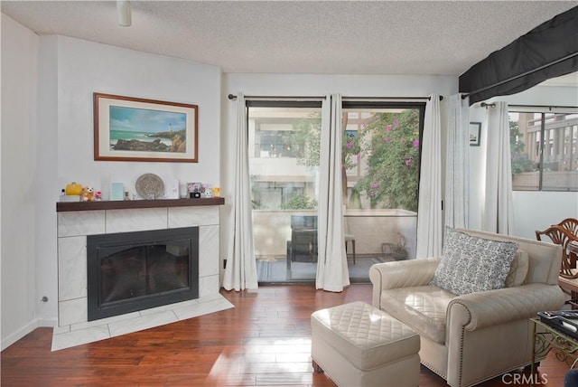 interior space featuring hardwood / wood-style floors, a textured ceiling, and a wealth of natural light