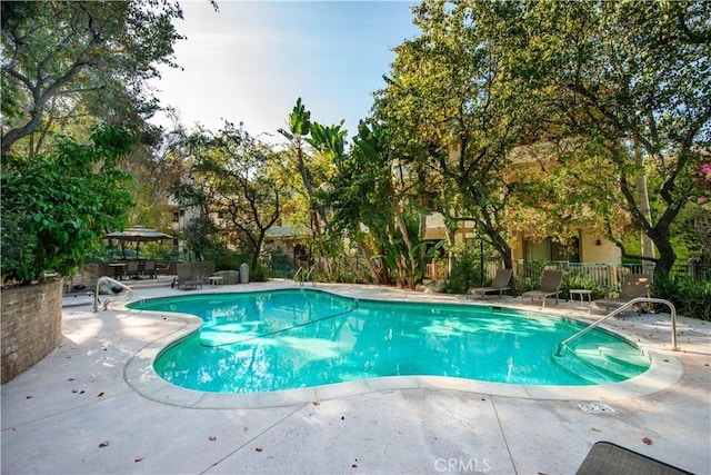 view of swimming pool featuring a patio area