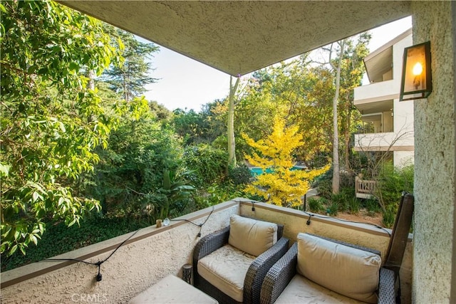 view of patio with a balcony