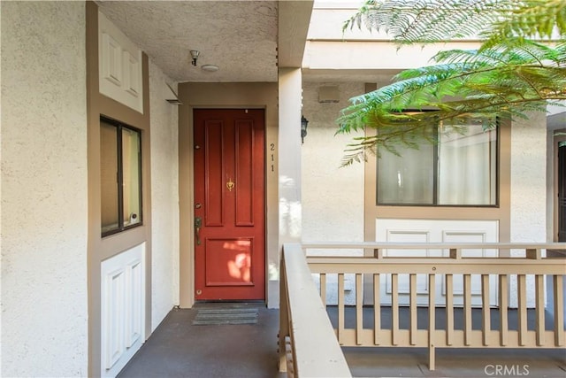 property entrance featuring a porch