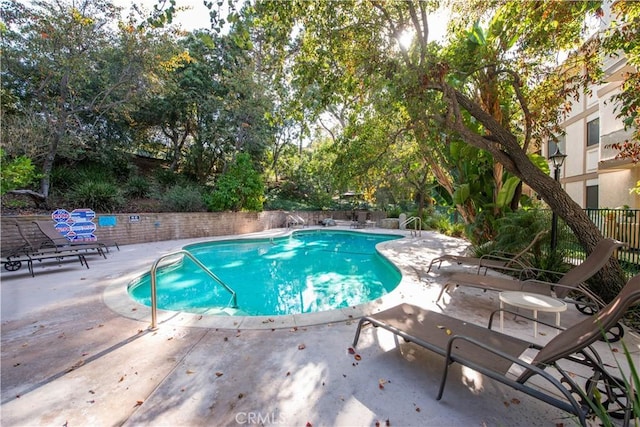 view of swimming pool featuring a patio