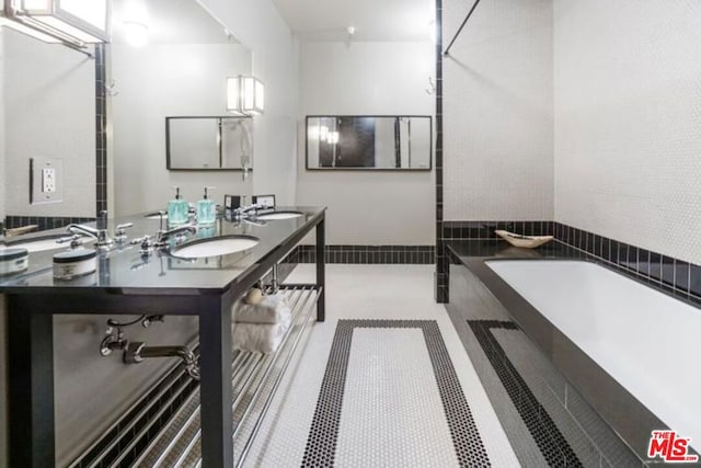 bathroom featuring a bath and vanity