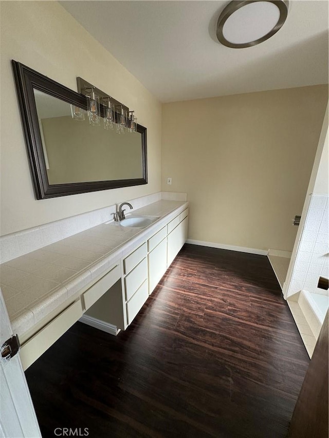 bathroom with vanity and wood-type flooring