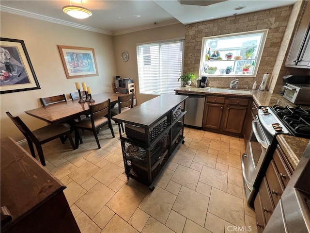 kitchen with light stone countertops, stainless steel appliances, backsplash, light tile patterned floors, and crown molding