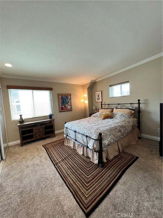 carpeted bedroom featuring ornamental molding and multiple windows