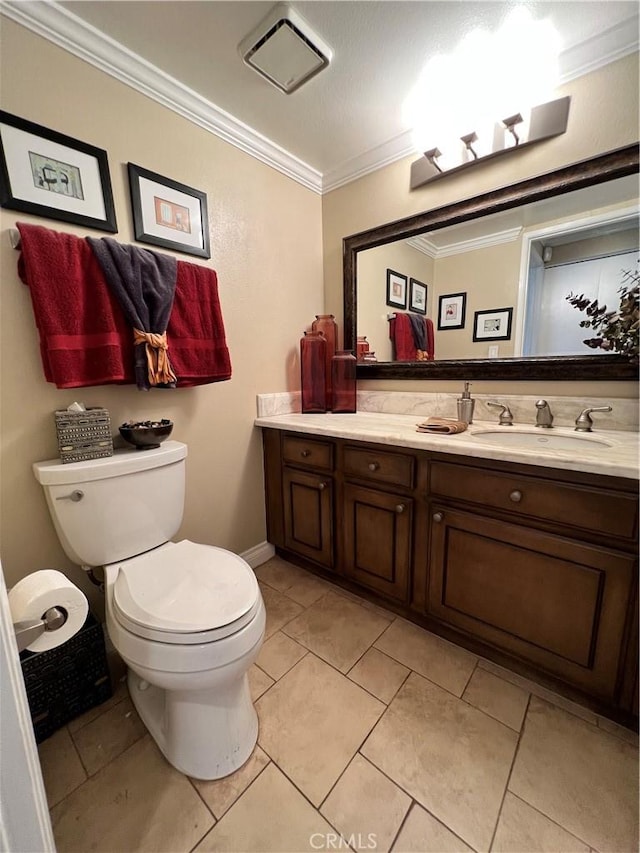 bathroom featuring toilet, crown molding, tile patterned floors, and vanity