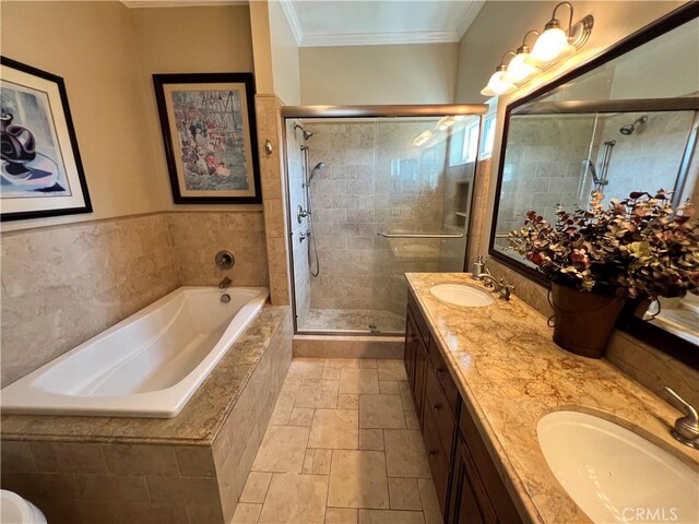 bathroom with vanity, independent shower and bath, and ornamental molding