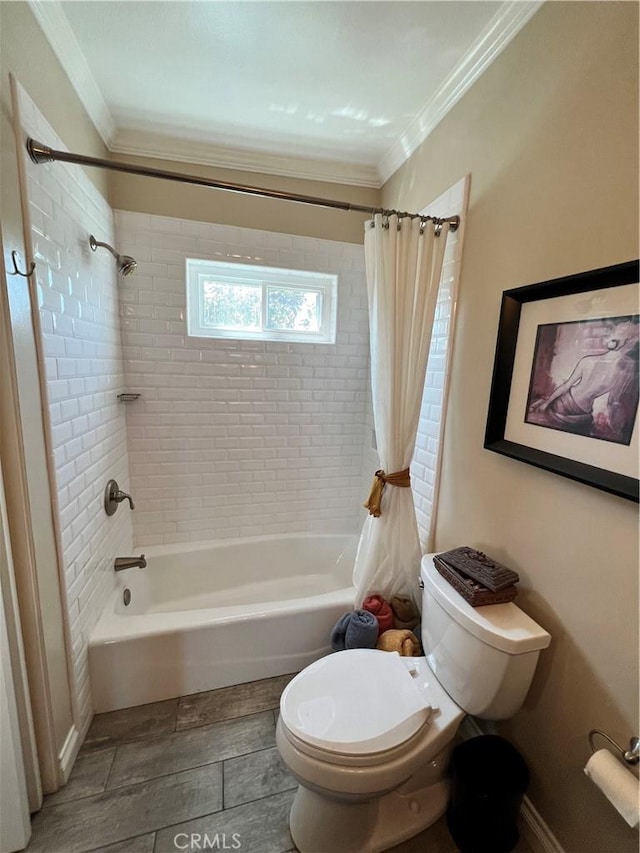 bathroom with toilet, crown molding, and shower / tub combo