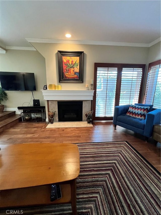 living room featuring ornamental molding and hardwood / wood-style floors