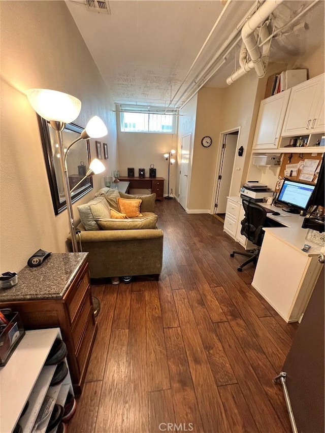 living room with dark hardwood / wood-style flooring