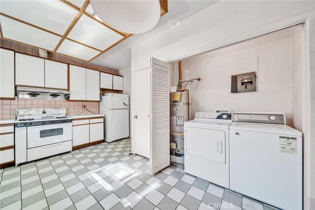 laundry area with independent washer and dryer and water heater