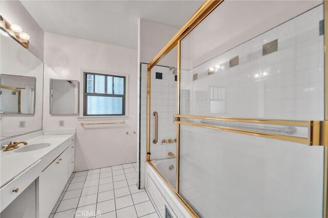 bathroom featuring shower / bath combination with glass door, tile patterned flooring, and vanity