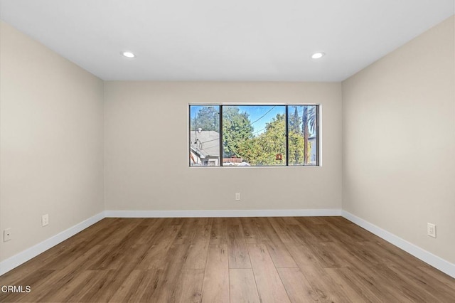 spare room featuring hardwood / wood-style flooring