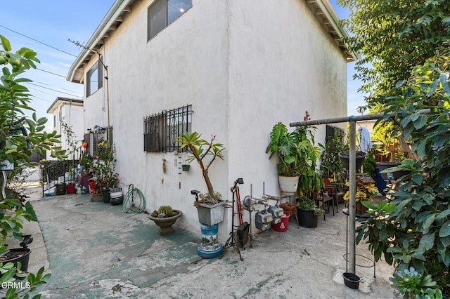 view of side of home featuring a patio