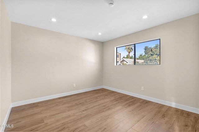 spare room with light wood-type flooring