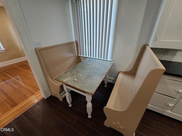 dining room with dark wood-type flooring