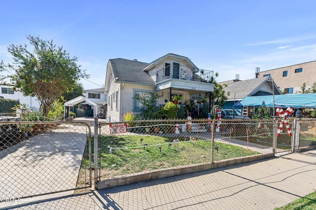 view of front of home featuring a balcony and a front lawn