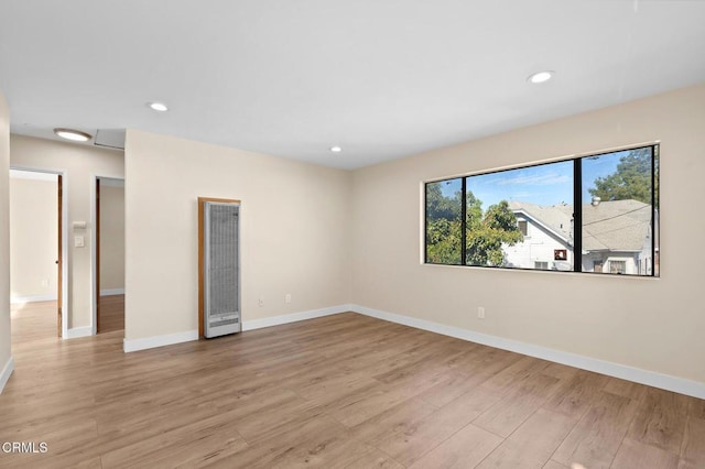 spare room featuring light wood-type flooring