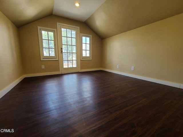 bonus room featuring dark hardwood / wood-style flooring and lofted ceiling