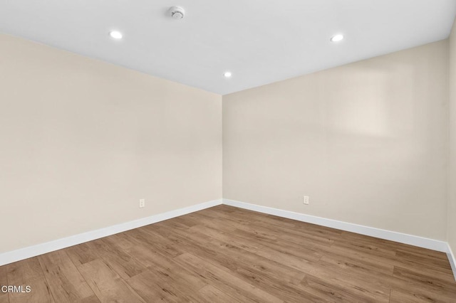 spare room featuring light hardwood / wood-style floors