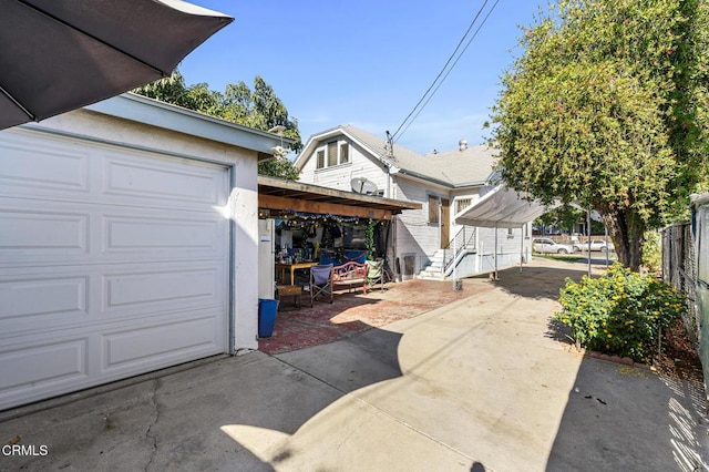 garage featuring a carport