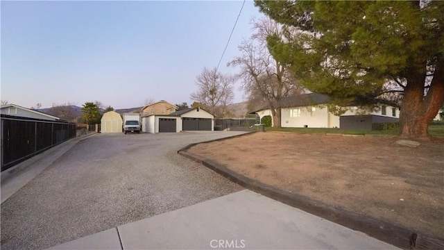 yard at dusk with a garage